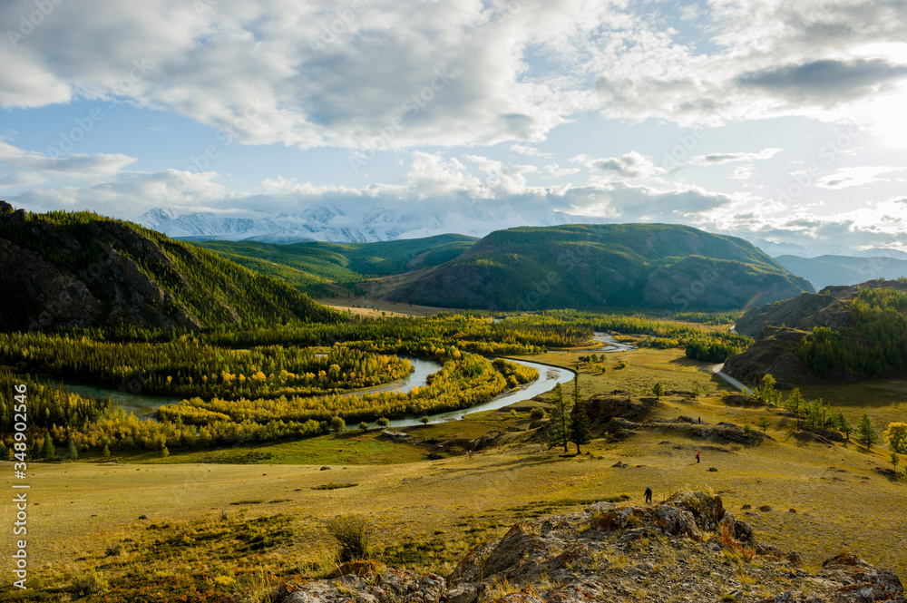 Autumn landscape with mountains, winding river, forest and highway. Altai.
