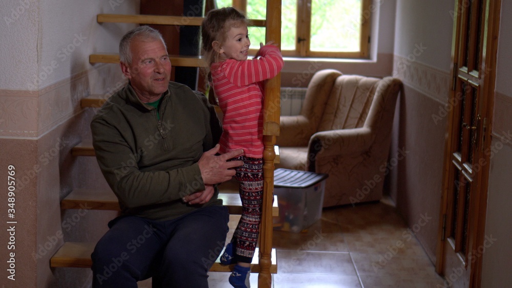 Little girl playing with grandfather. Little girl playing with grandfather.