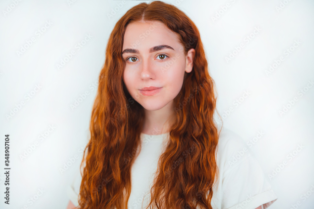 portrait of redheaded young woman looking natural smiling standing on isolated white backgroung, style and beauty concept portrait of redheaded young woman looking natural smiling standing on isolated white backgroung, style and beauty concept