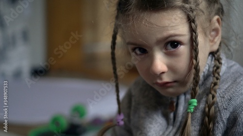 Child abuse. Crying little girl. 