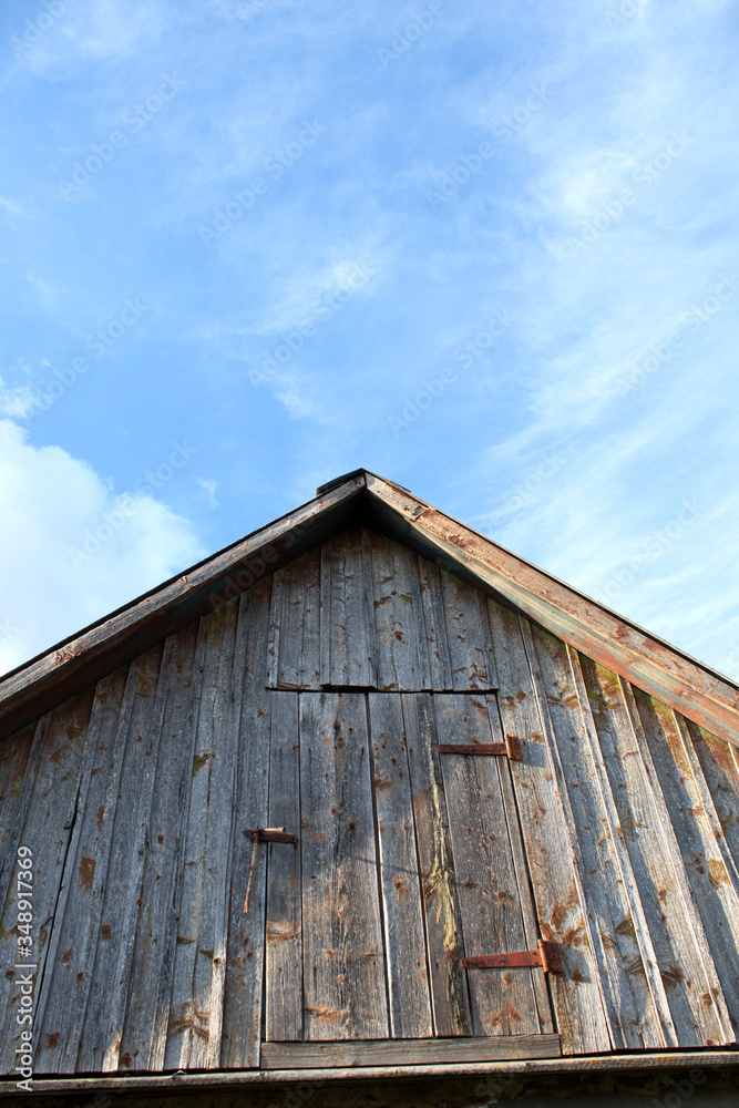 The roof of an old house on a background of sky