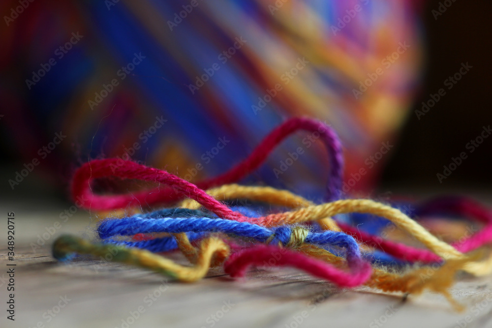 textured colored wool thread on a blurred background