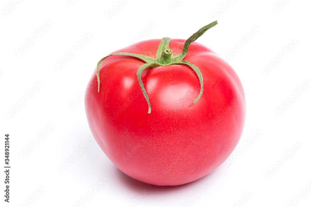 Red fresh tomato isolated on white background in close-up Red fresh tomato isolated on white background in close-up