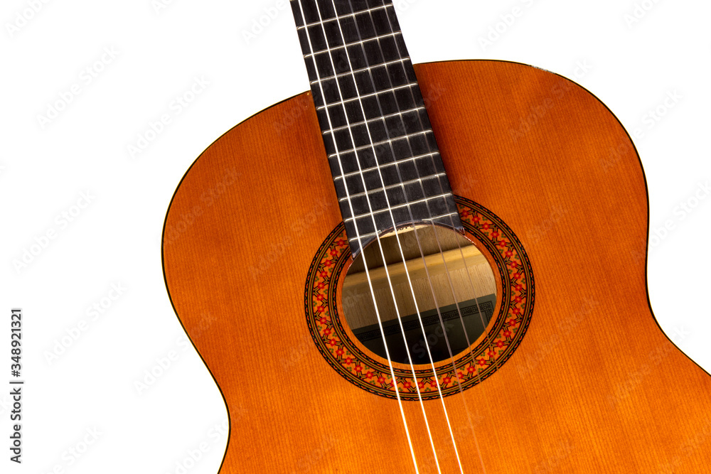 Acoustic guitar neck with body and strings on white background in close-up