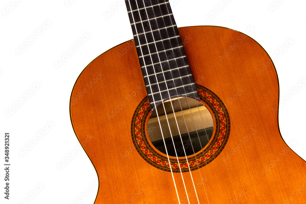Acoustic guitar neck with body and strings on white background in close-up Acoustic guitar neck with body and strings on white background in close-up