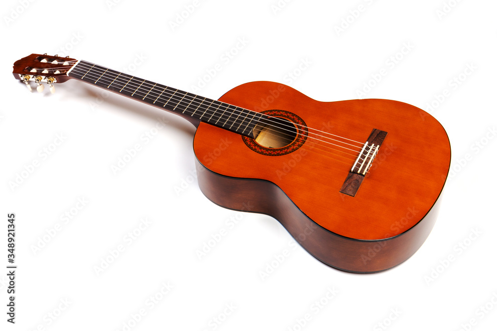 Acoustic guitar neck with body and strings on white background in close-up