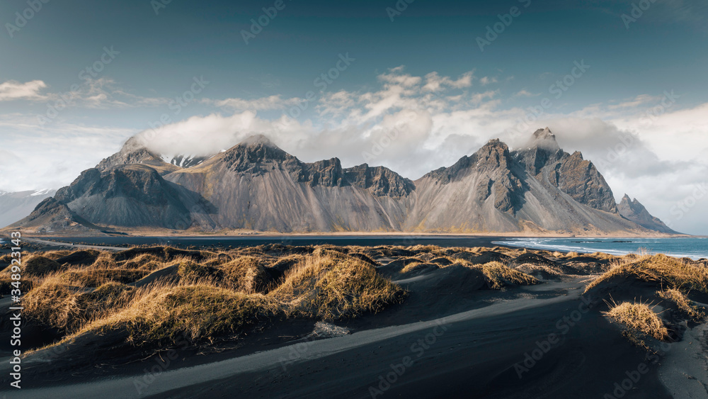 Vestrahorn with clouds and sand dunes Iceland Europe