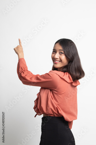 Back of Asian woman touching the screen with her finger .