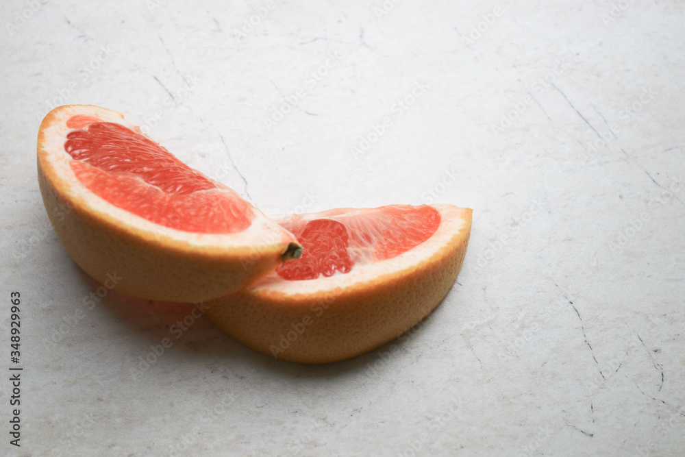 Grapefruit halves on the table Grapefruit halves on the table