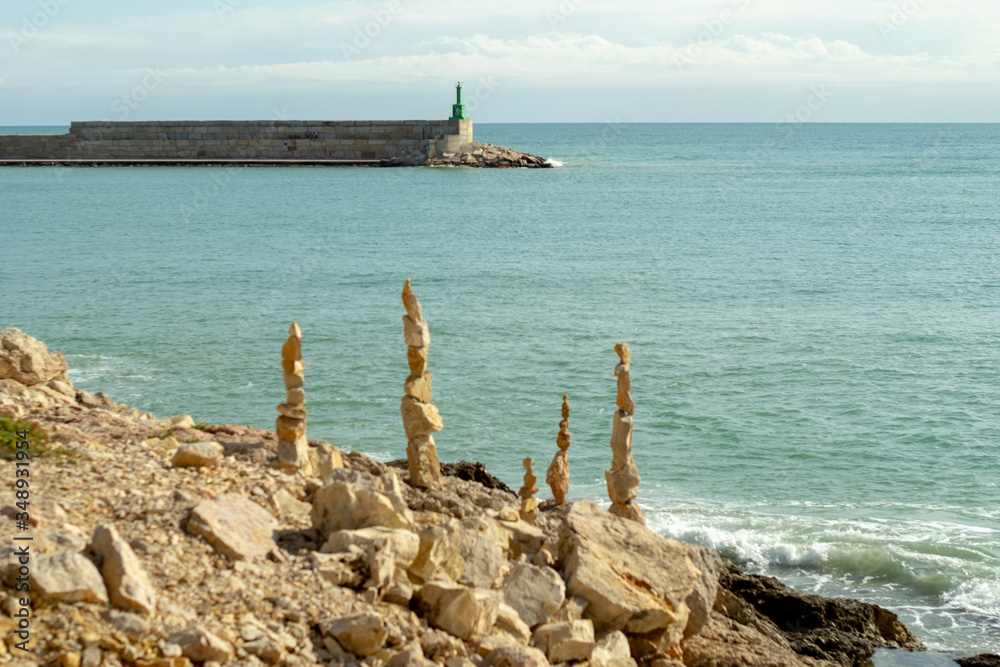 
Stone sculptures in Zen balance on the south coast of Peñíscola, Mediterranean Sea