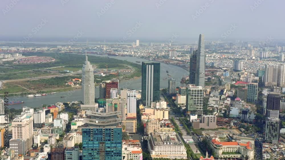 HOCHIMINH, VIETNAM - APRIL, 2020: Aerial drone view of skyscrapers and other modern buildings at downtown of Hochiminh.
