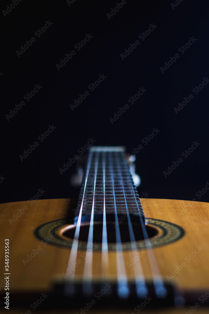 Fototapeta premium classic spanish guitar on black background