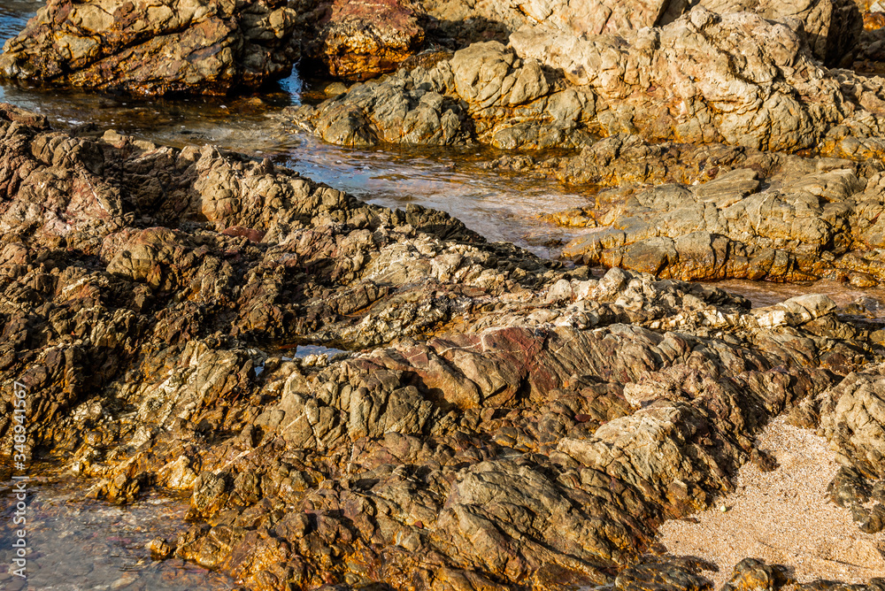 Large boulders on the sea coast. Beautiful rock pattern on the beach landscape. Many stone under the clear sea. Panoramic view, travel location. Beauty in nature. Krating Bay, Chanthaburi ,Thailand. Large boulders on the sea coast. Beautiful rock pattern on the beach landscape. Many stone under the clear sea. Panoramic view, travel location. Beauty in nature. Krating Bay, Chanthaburi ,Thailand.