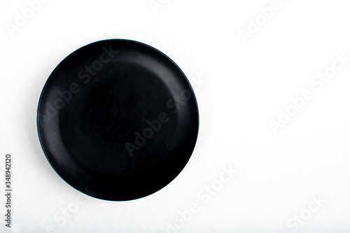 Black stone slate serving plate heart shaped, isolated on white background. space for copy text