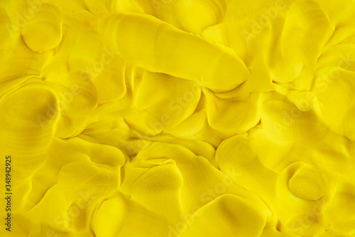 Play clay yellow background texture photo