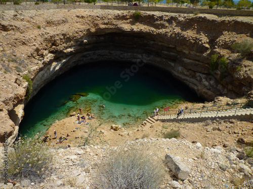 View of Bimmah Sinkhole one of the most beautiful destinations in Oman. The sink hole is filled with booth salty and fresh water photo