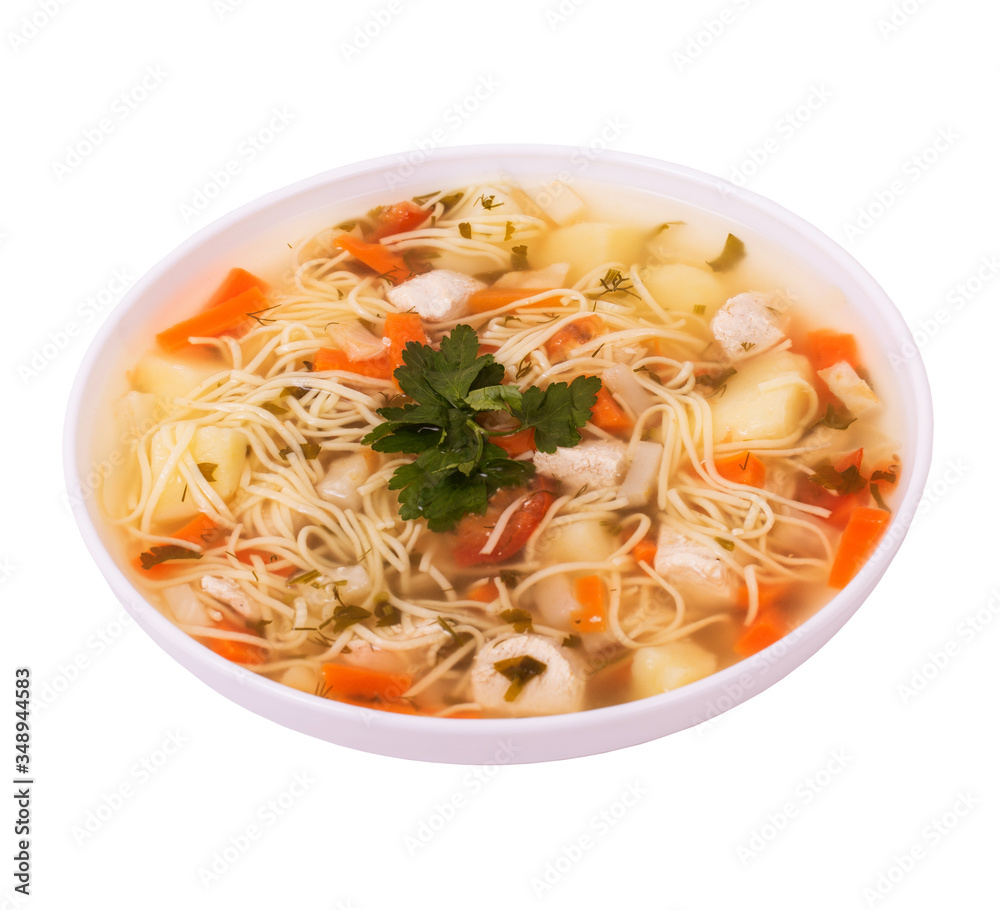 Homemade soup with pieces of chicken breast, carrots, potatoes, noodles and parsley, isolated on white background, angle view Homemade soup with pieces of chicken breast, carrots, potatoes, noodles and parsley, isolated on white background, angle view