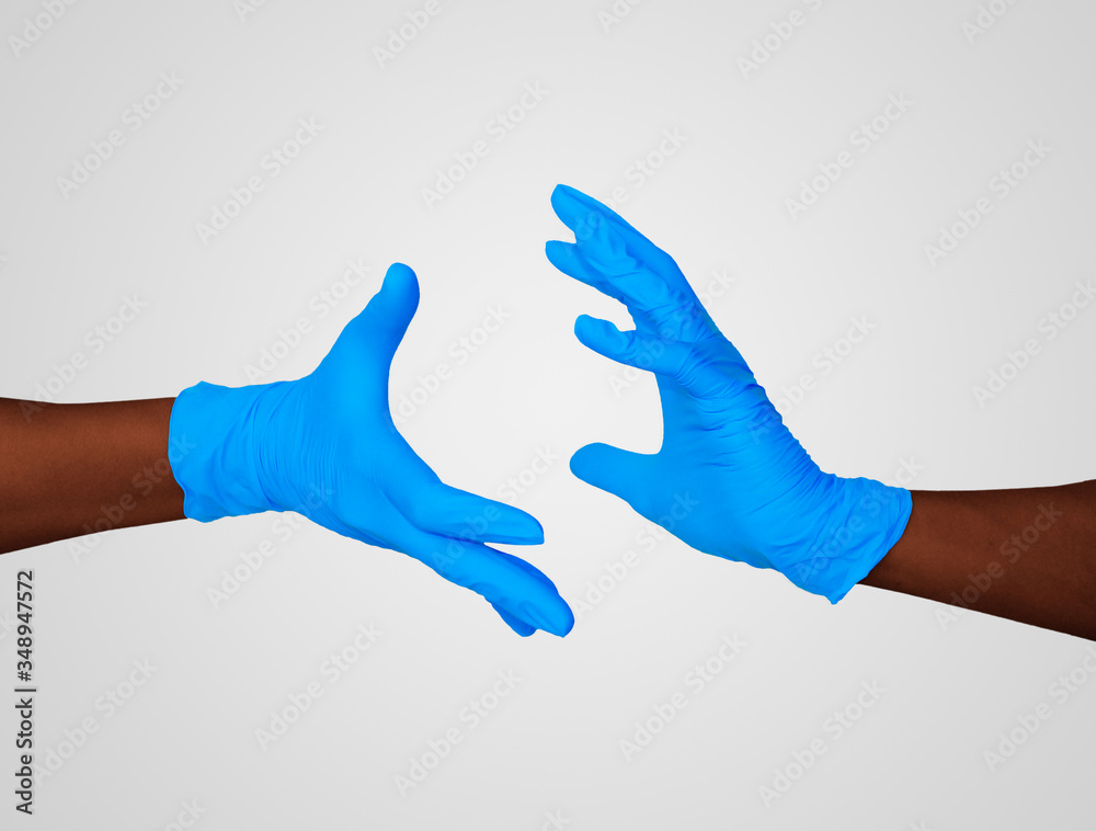 Nitrille glove. Medic's hands holding some round
Nitrille glove. Medic's hands holding some round