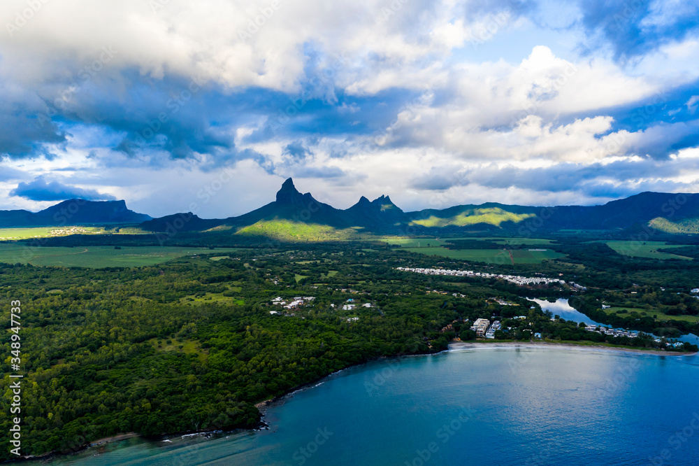 Aerial view The beach at Flic en Flac with luxury hotels and palm trees, behind the mountain Tourelle du Tamarin, Mauritius, Africa