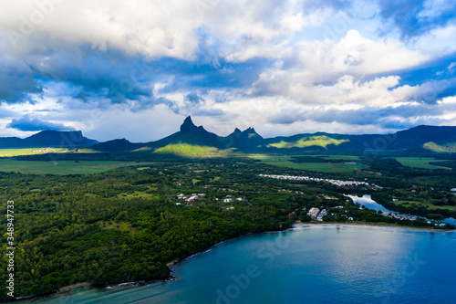 Aerial view The beach at Flic en Flac with luxury hotels and palm trees, behind the mountain Tourelle du Tamarin, Mauritius, Africa © David Brown