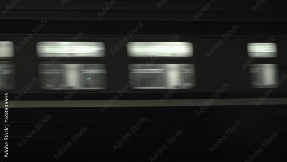 Old soviet russian empty diesel passenger train goes at night. Electric multiple unit, electricity. Travel and tourism concept. Railroad wagon. Transportation. Old soviet russian empty diesel passenger train goes at night. Electric multiple unit, electricity. Travel and tourism concept. Railroad wagon. Transportation.