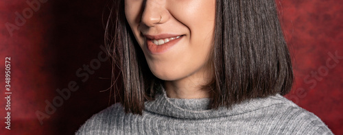 Close up of young woman with nose piercings
