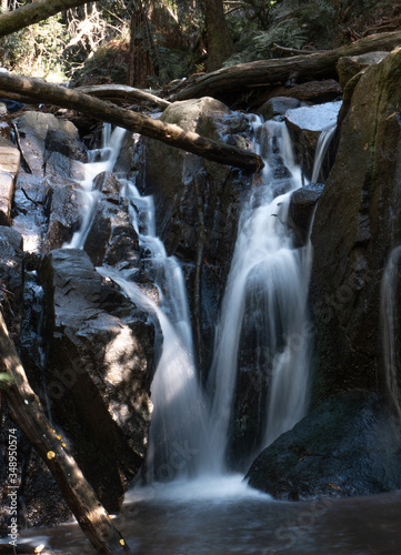 small waterfall in forest long exposure