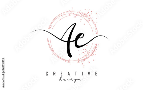 Handwritten AE a e letters logo with dust pink sparkling circles and glitter. photo