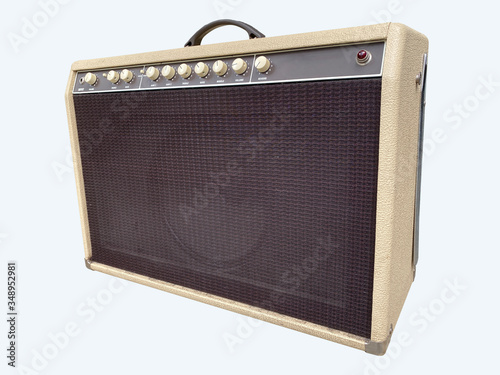 Isolated brown leather and cream white control panel of vintage drive medium electric guitar amplifier combo on white background with work path.