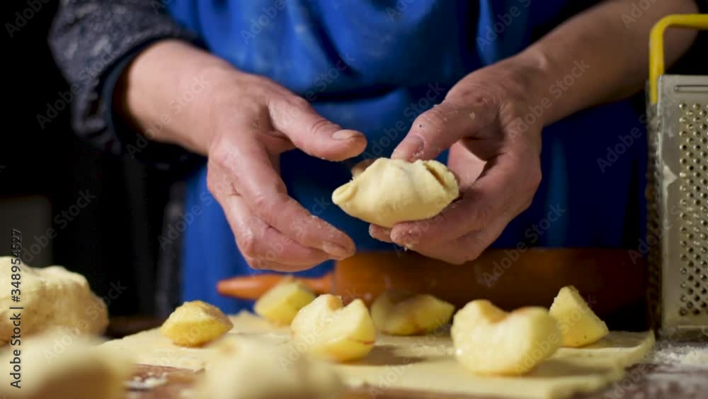 Home scene with woman preparing home made food in the kitchen. Lockdown activity indoor to stay at home concept after coronavirus quarantine.