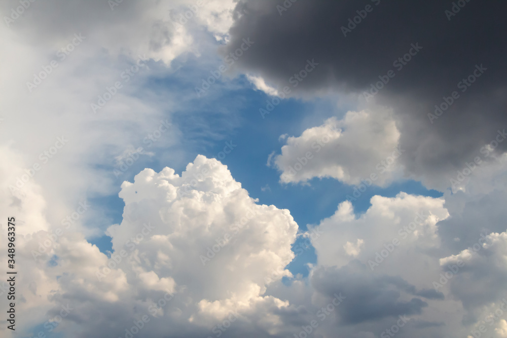 Dramatic sky with cumulus clouds before rain. Blue sky around fluffy cloud. Beautiful landscape. Heaven theme. Dramatic sky with cumulus clouds before rain. Blue sky around fluffy cloud. Beautiful landscape. Heaven theme.