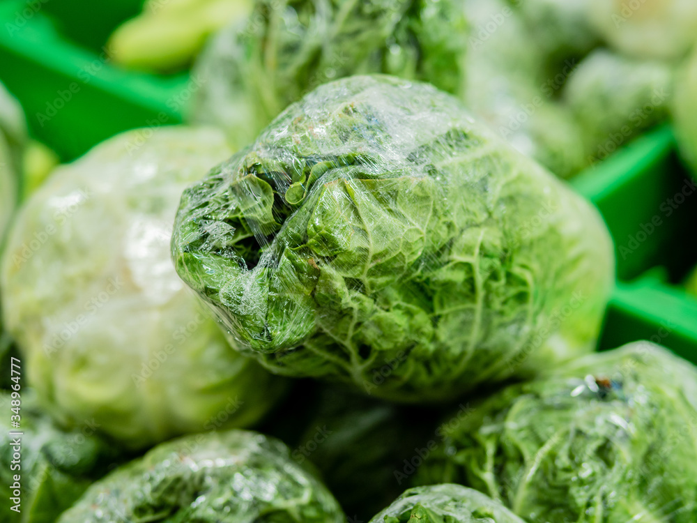 Obraz premium Chinese cabbage. Beijing cabbage is sold on the counter in the supermarket.