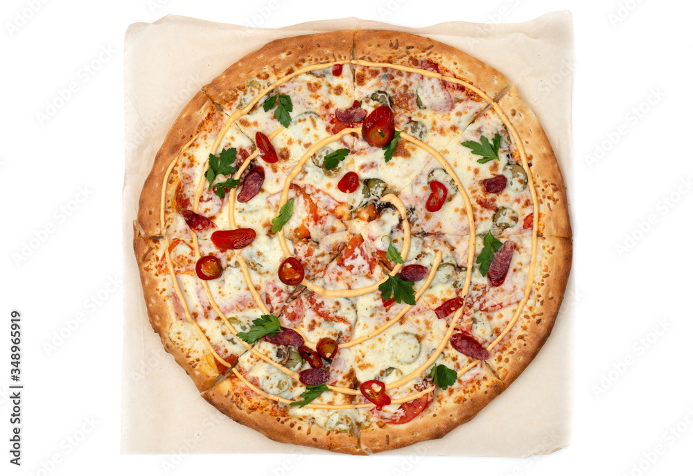 Hot pizza on parchment paper. Tasty pizza with cheese, sausage, jalapenos and tomatoes on a white background. Top view..