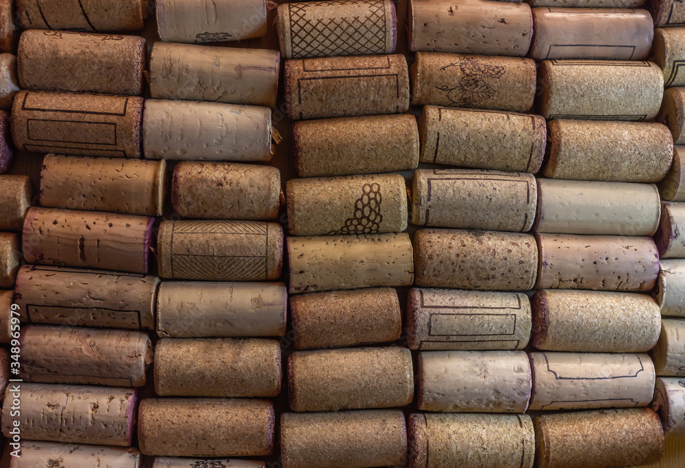 Wine cork collected in orderly rows. Background for winemakers and alcohol products. Natural cork texture for wine Wine cork collected in orderly rows. Background for winemakers and alcohol products. Natural cork texture for wine