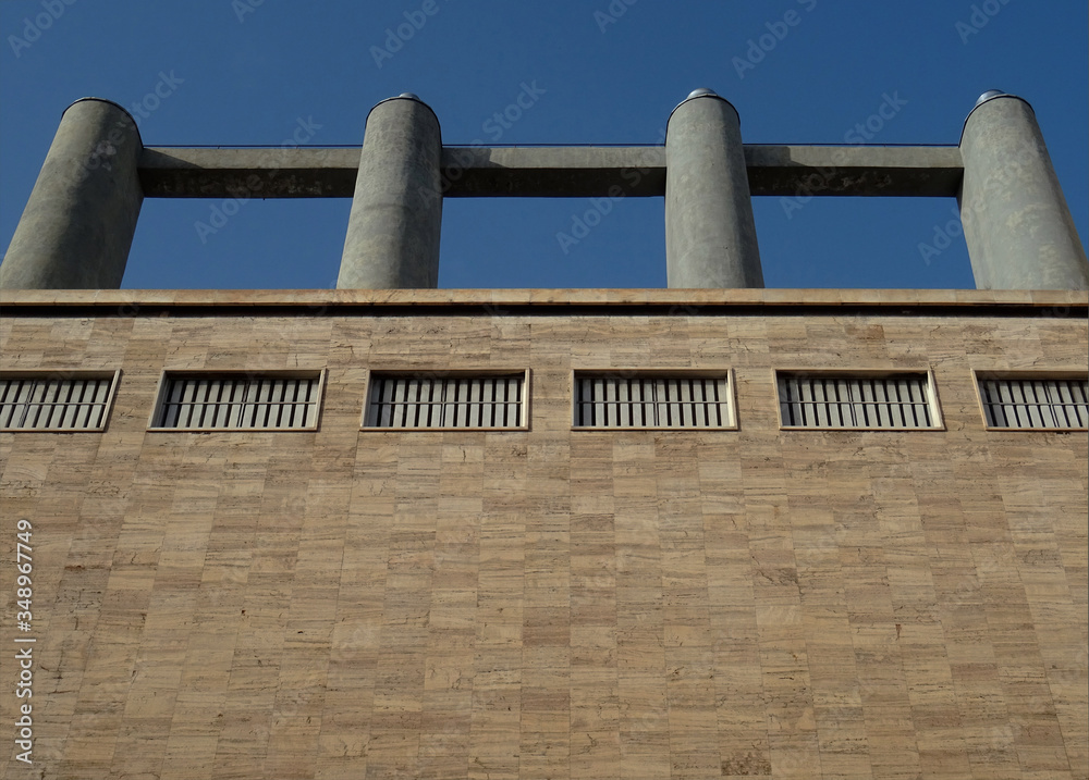 Architecture of the 50´s with travertine covering wall in Roma. Italy. Architecture of the 50´s with travertine covering wall in Roma. Italy.