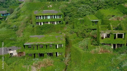 Houtouwan, Zhejiang China - Aerial view of China's abandoned fishing village. Plants Are Taking Over This Abandoned Fishing Village.
