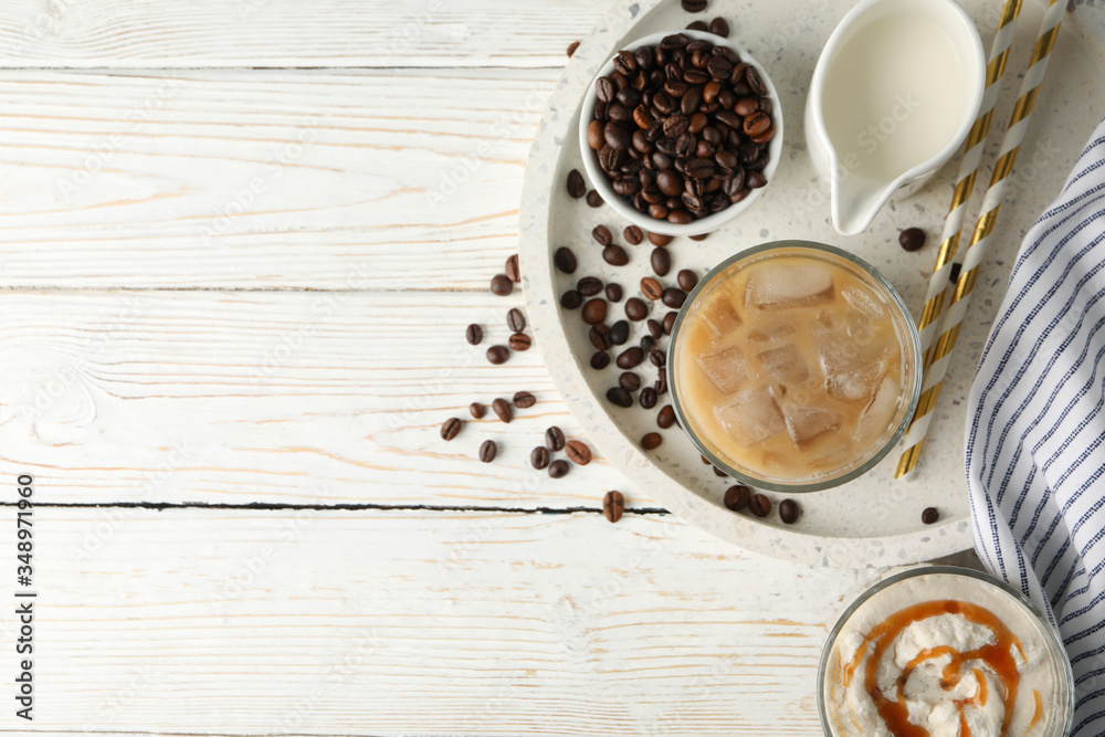 Composition with tray with ice coffee on wooden background Composition with tray with ice coffee on wooden background