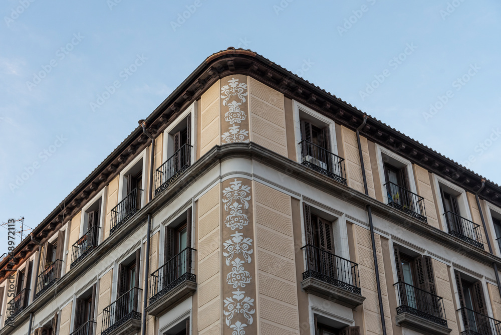 Corner of a typical building in the historic center of Madrid, Spain. Downtown, residential building