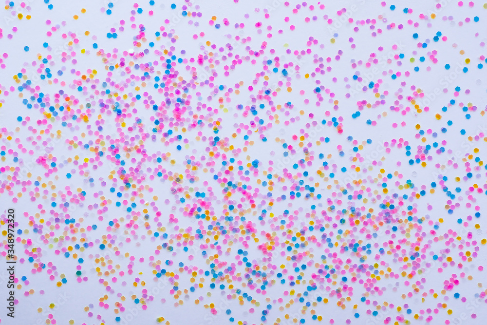 Abstract background multicolored small confetti on a white background. Copy space..