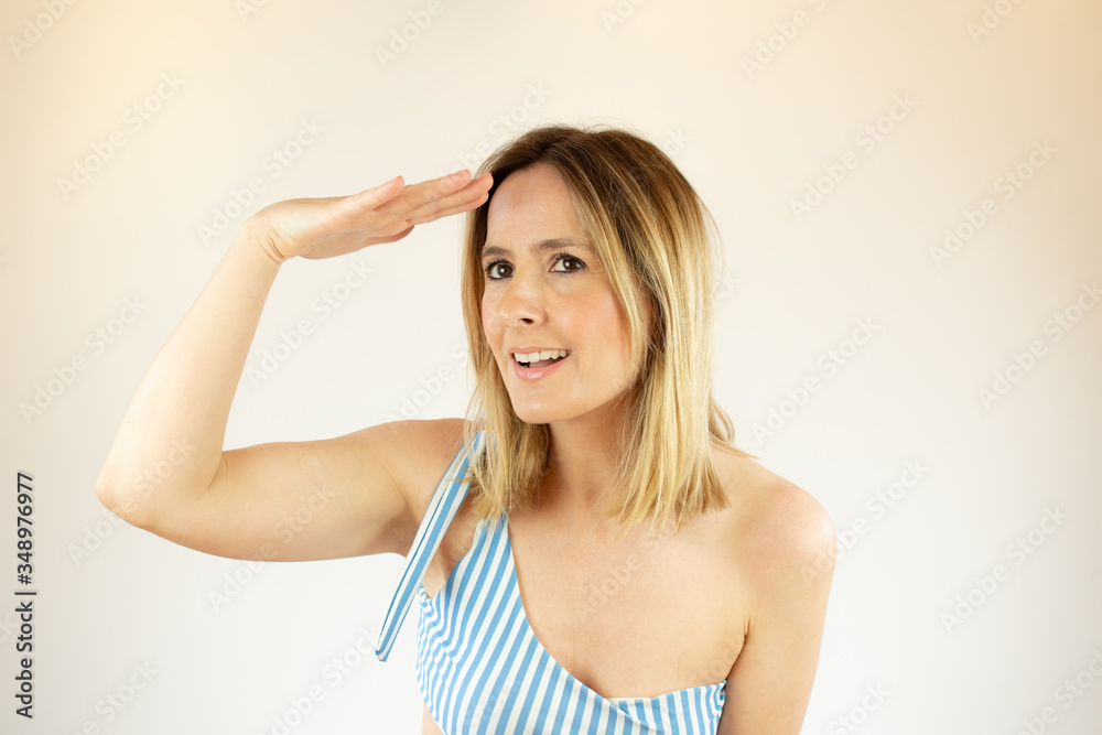 Beautiful woman wearing bikini is making a gesture Beautiful woman wearing bikini is making a gesture