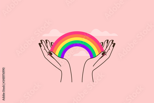 Vector illustration in flat simple linear style - hand and pride LGBT rainbow heart - lesbian gay bisexual transgender love photo