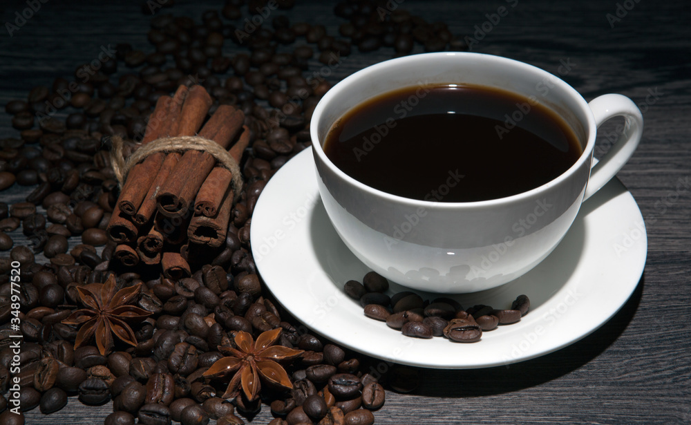 cup of hot coffee and roasted coffee beans on a wooden table cup of hot coffee and roasted coffee beans on a wooden table