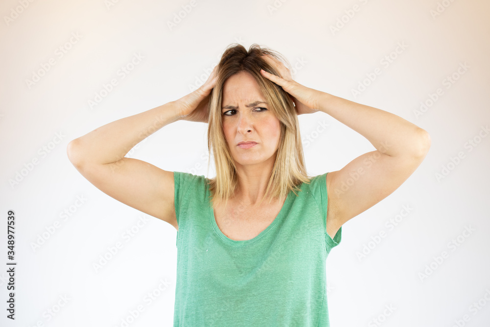 Beautiful woman making gesture with hands on head Beautiful woman making gesture with hands on head
