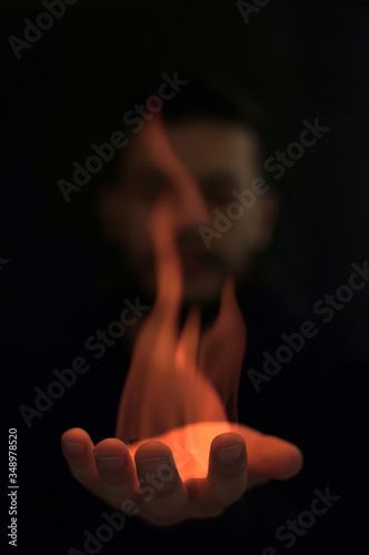 man with flame in the hand