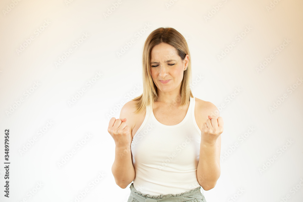 Beautiful woman doing victory gesture with arms Beautiful woman doing victory gesture with arms