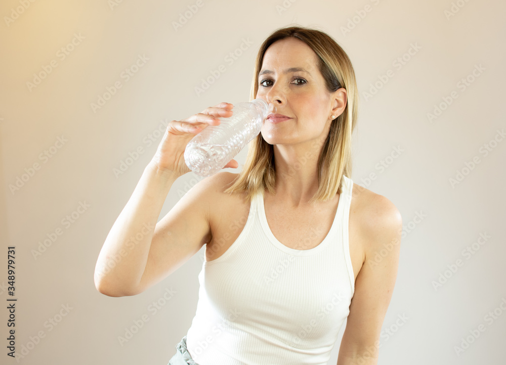 Beautiful woman making gesture of drinking water