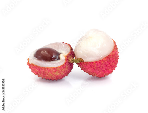 fresh two red lychee sweet fruit open peel. Isolated on white background with