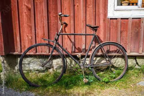 Old bicycle on a wooden wall