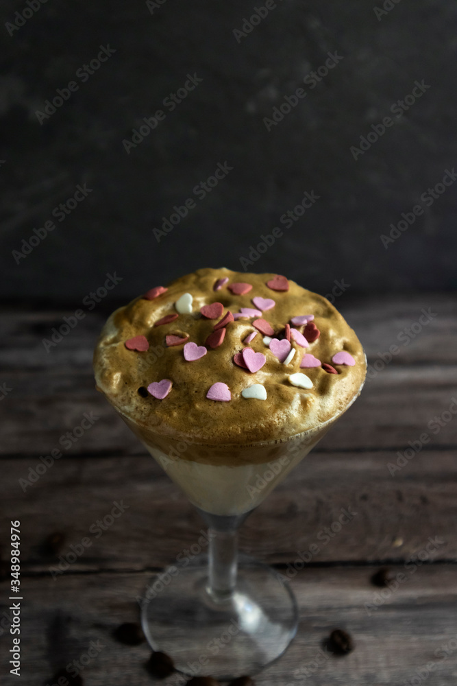 Dalgona coffee flat lay with heart sprinkling, trend 2020, Valentine's Day coffee, trendy Korean drink, Latte espresso with coffee foam Dalgona coffee flat lay with heart sprinkling, trend 2020, Valentine's Day coffee, trendy Korean drink, Latte espresso with coffee foam
