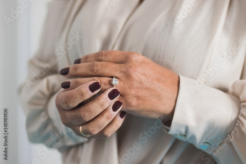 woman putting on a ring